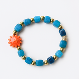 Bracelet Élastique Perles Bleues & Dorées – Médaillon Soleil Orange