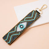 Porte-clés bohème avec perles et œil protecteur: MULTI